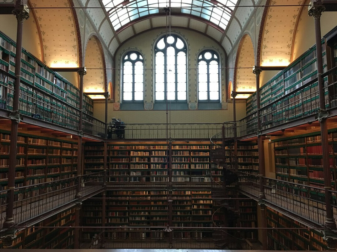 Interior of an old library with tall wooden shelves