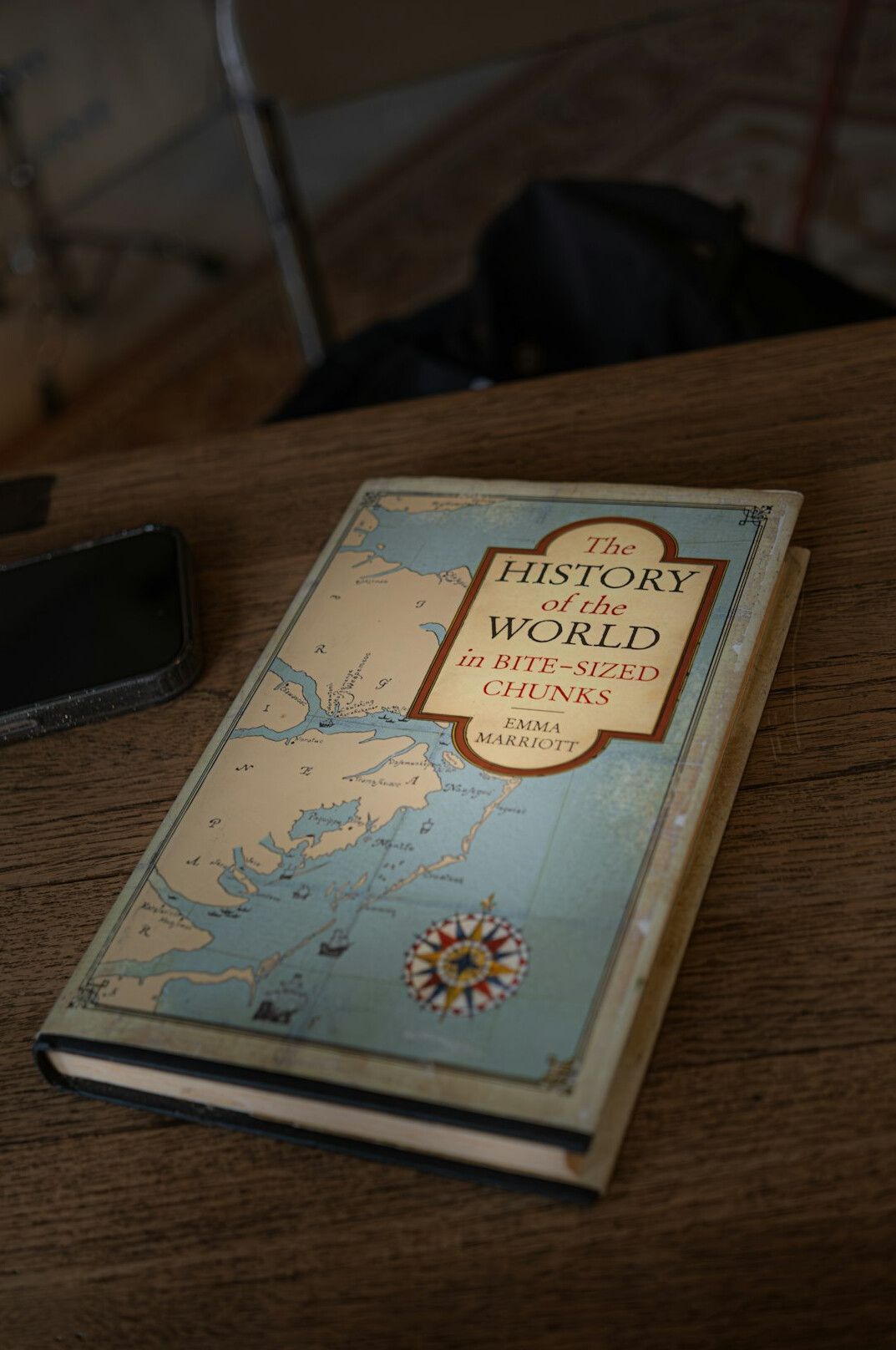 Antique map and compass on a wooden table